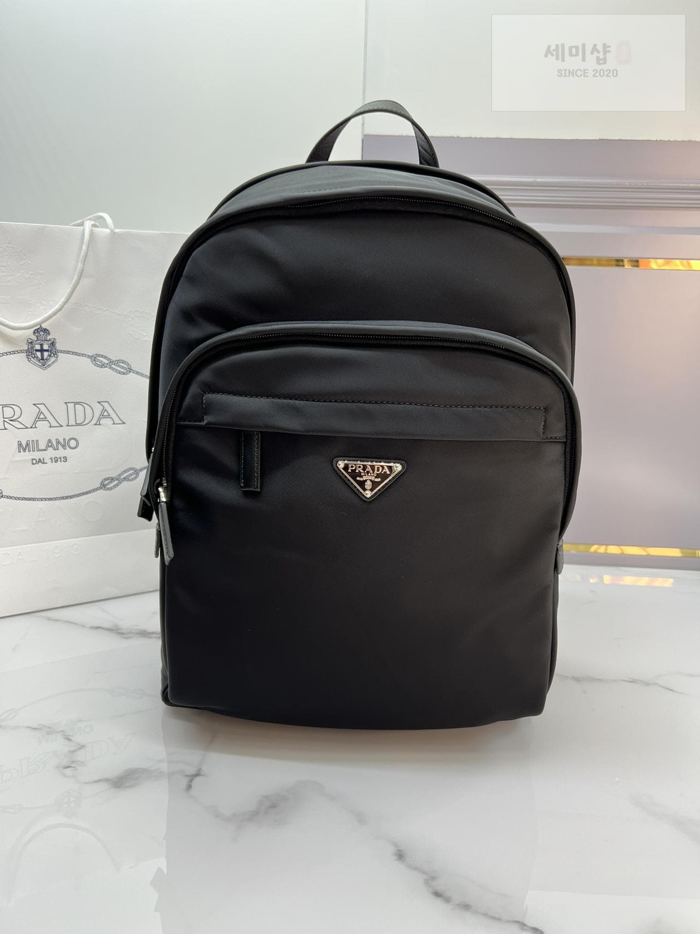 P R A D A Re-Nylon Logo Plaque BackPack - 세미샵